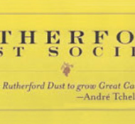 A yellow background with text: "Rutherford Dust Society" and a quote: "It takes Rutherford Dust to grow Great Cabernet. — André Tchelistcheff". Includes a grapevine illustration.