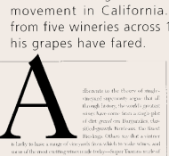 Close-up of a page in a book with text discussing wineries in California and a large capital letter "A" at the start of a paragraph.